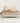 Rounded Channel Upholstered Bed — studio presentation with AI-edited background